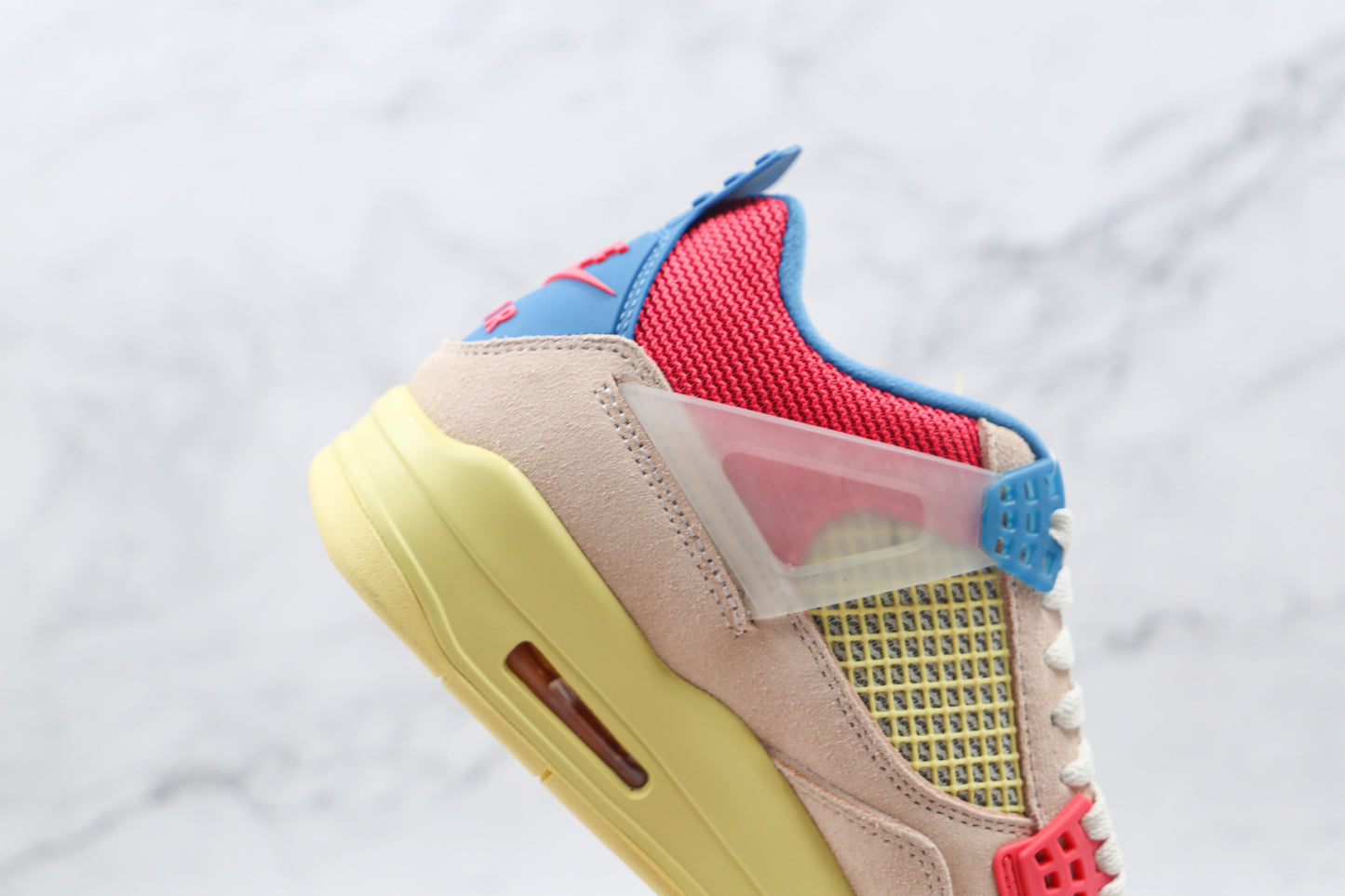 Jordan 4 Retro Union Guava Ice 